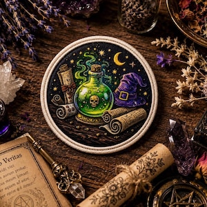 May include: A circular embroidered patch featuring a glowing green potion bottle with a skull icon, a purple pointed hat, and two rolled parchment scrolls against a dark starry night sky background with a yellow crescent moon.