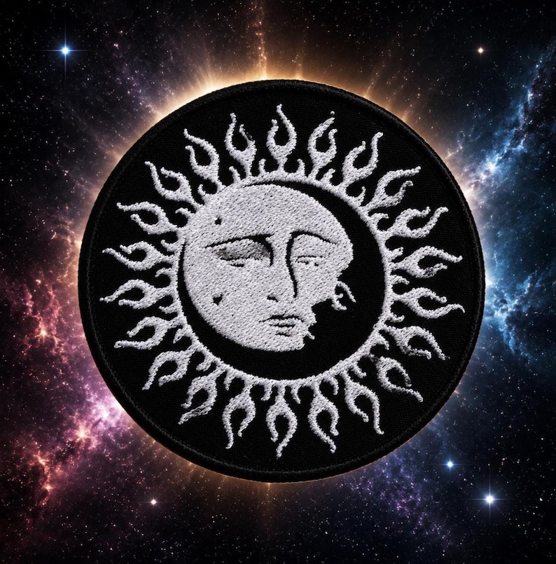 May include: A circular embroidered patch featuring a white sun face with closed eyes and a crescent moon silhouette integrated into the design. The sun is surrounded by white flame-like rays against a solid black background with a stitched border.