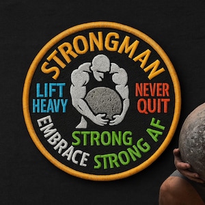 May include: Embroidered patch with the words "Strongman" and "Lift Heavy, Never Quit, Embrace Strong AF." The patch features a weightlifter holding a stone, with a black background and a yellow border.