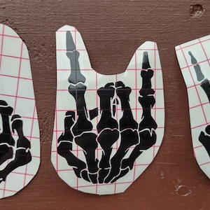 skeleton hand | decal | sticker | rock on | middle finger | car | laptop | tablet | peace | bumper sticker