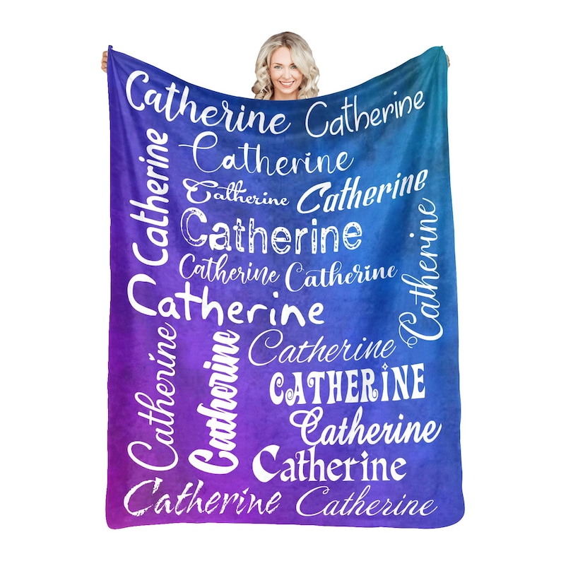 May include: A purple and blue ombre fleece blanket with the name "Catherine" repeated in white text throughout the design.