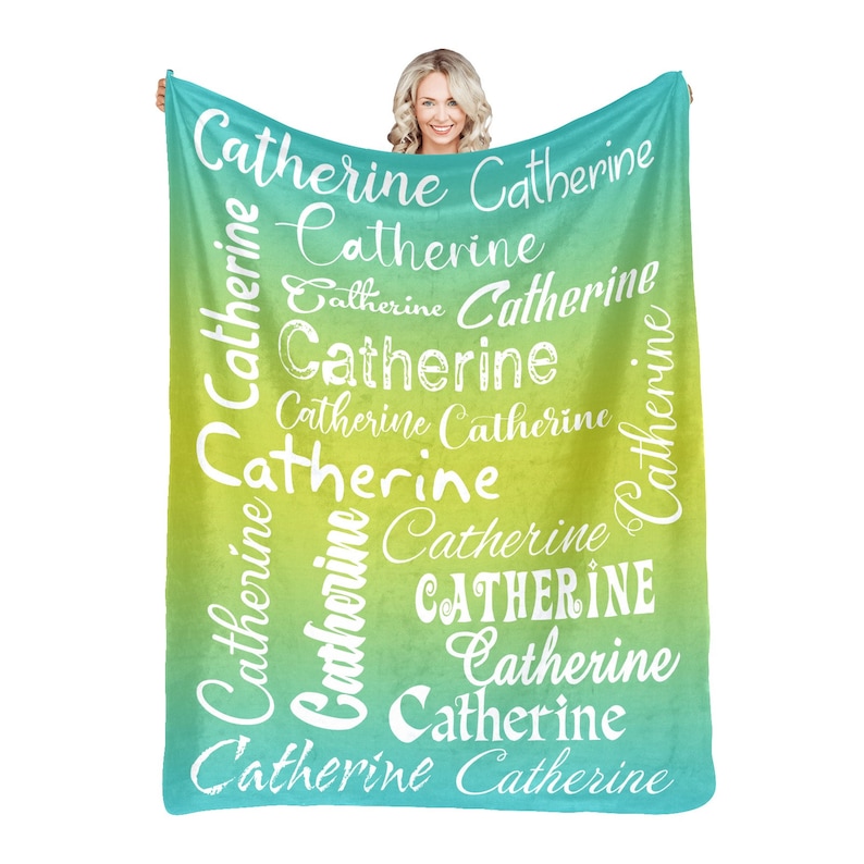May include: A soft, green and blue ombre throw blanket with the name "Catherine" repeated in white text throughout the design.