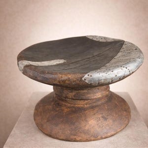 Vintage Handcarved African Stool: Wooden Side Table with Metallic Detail