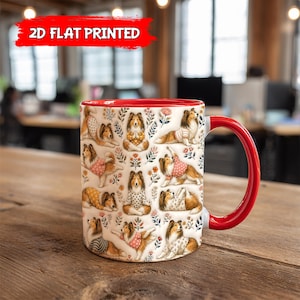 May include: A white ceramic mug with a red interior and handle. The mug is decorated with a repeating pattern of Shetland Sheepdog illustrations in various poses, wearing sweaters and surrounded by floral elements. The text "2D FLAT PRINTED" is in a red banner.