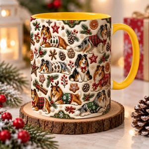 May include: A ceramic mug with a bright yellow interior and handle, featuring a repeating pattern of Shetland Sheepdogs wearing festive holiday sweaters, surrounded by illustrations of pine cones, holly, stars, and orange slices.