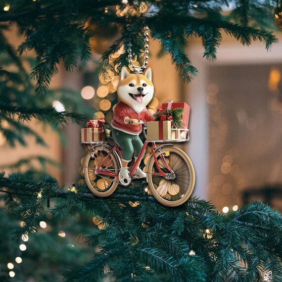 Ornamento 2D piatto e divertente raffigurante uno Shiba Inu, cane Shiba che va in bicicletta, ornamento da appendere all'auto per cani, regali di Natale, regalo per gli amanti degli Shiba