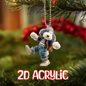 May include: A 2D acrylic ornament of a cartoon dog wearing a hat, jacket, striped shirt, jeans, and sneakers. The dog has a backpack and is hanging from a silver chain. The text "2D ACRYLIC" is at the bottom in red and white.