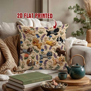 May include: A square throw pillow with a cream-colored background featuring a repeating pattern of various spaniel-type dogs wearing sweaters and surrounded by colorful flowers. The text 2D FLAT PRINTED is visible at the top of the pillow.