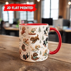 May include: A white ceramic mug with a red interior and handle, featuring a repeating pattern of various small dogs in sweaters skiing and sledding, interspersed with green pine trees and snowflakes, with the text 2D FLAT PRINTED at the top.