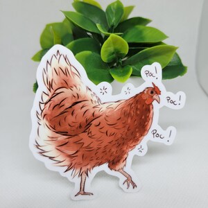 May include: A brown and white chicken sticker with the word "Poc!" written three times around it.