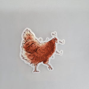 May include: A brown chicken sticker with the word "poc!" written three times around it.