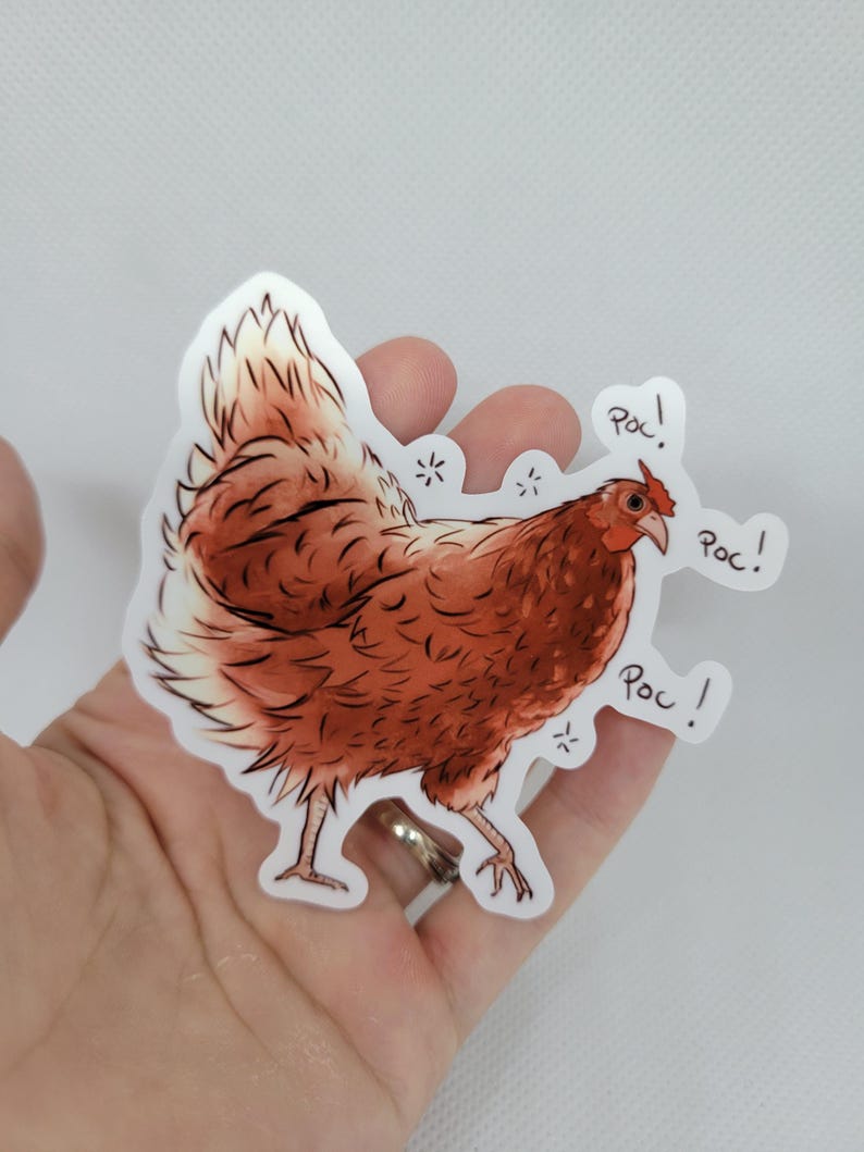 May include: A brown chicken sticker with the word "Poc!" written three times around it.