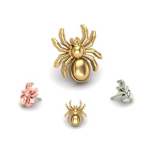May include: Four spider earrings in different colors: gold, silver, and rose gold. The earrings are in the shape of a spider with eight legs and a round body.