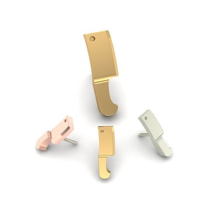 May include: Three gold-toned, silver-toned, and rose gold-toned earrings shaped like a butcher knife.