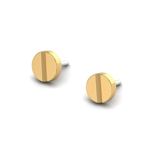May include: A pair of gold screw-shaped stud earrings.