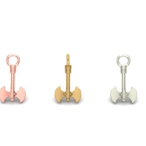 May include: Three axe-shaped pendants in different metal finishes: rose gold, gold, and silver.