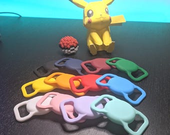 May include: A collection of colorful silicone AirTag holders in various colors, including yellow, orange, red, blue, green, pink, and purple. A yellow Pikachu figure and a pixelated Pokeball are also present.