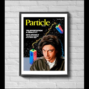 May include: Framed magazine cover art featuring a portrait of Seth Brundle. The magazine title is "Particle" in yellow, with the headline "Teleportation A Reality?" and the text "Youthful Father of a New Age". The artwork has a retro sci-fi aesthetic.