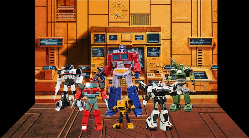 May include: A group of six Transformers action figures, including Optimus Prime, Bumblebee, and Ironhide, standing in front of a yellow and brown control panel. The figures are made of plastic and have articulated limbs.