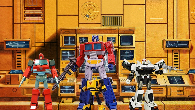 May include: Five Transformers action figures in a futuristic setting. The figures are Optimus Prime, Bumblebee, Ironhide, Prowl, and Starscream. The figures are all in their robot modes and are posed in a variety of action poses.