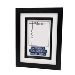 May include: A black framed picture with a white mat. The frame holds a white rectangle with the dimensions 85mm x 75mm. Below the rectangle are three blue lines of text that read: "SGT JOHN WALSH", "THAMES VALLEY POLICE", and "20/05/05 - 19/05/24".