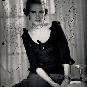 May include: A monochrome vintage advert showing a woman in a black sweater with a ruffled neckline and sleeves, a pearl necklace, and a bracelet. The text "Knit to Make a Hit..." is at the top of the image.