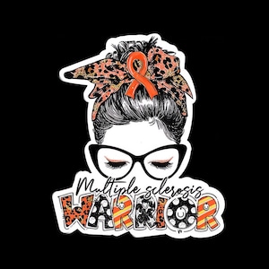 May include: A sticker featuring a woman with black-framed glasses and closed eyes, wearing a leopard print headscarf and an orange ribbon. The words "Multiple sclerosis WARRIOR" are displayed in a stylized font.