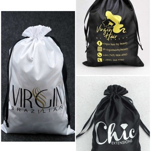 May include: Three drawstring satin bags with different logos. The first bag is white with black drawstring and the logo "VIRGIN BRAZILIAN". The second bag is black with gold drawstring and the logo "Virgin Hair by Beauty" with contact information. The third bag is black with white drawstring and the logo "Chic Extensions".