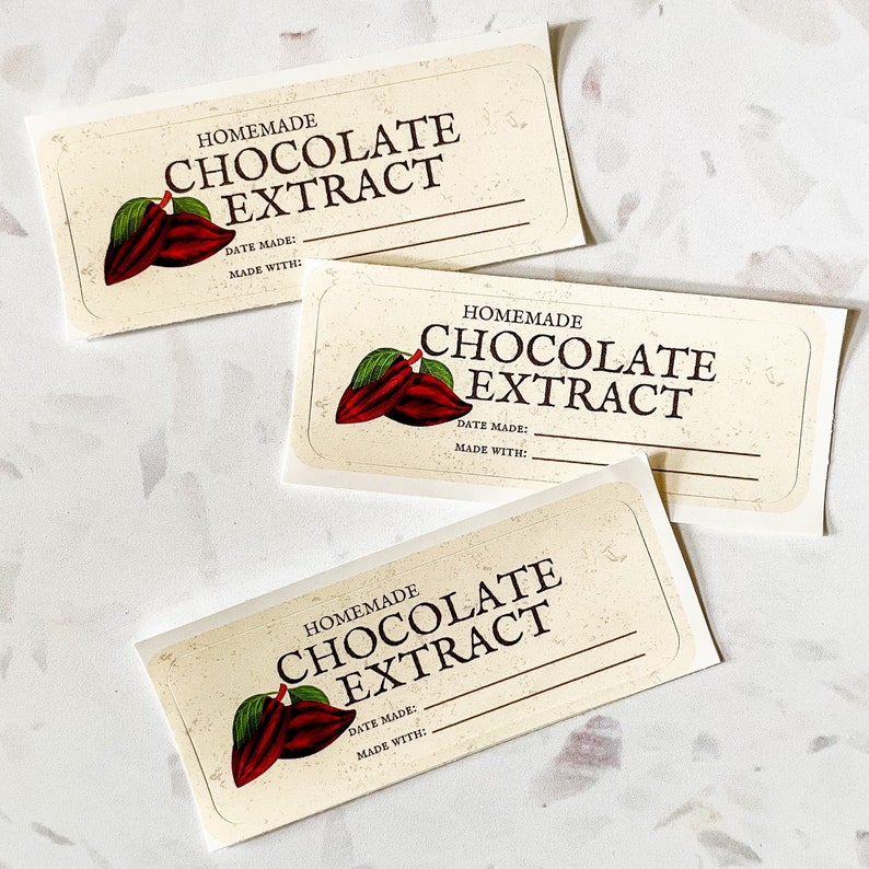 May include: Three blank labels for homemade chocolate extract. Each label features a brown and green cocoa pod illustration and the text "HOMEMADE CHOCOLATE EXTRACT". The labels also have blank lines for "DATE MADE" and "MADE WITH".