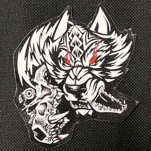 May include: Black and white illustration of a wolf with red eyes snarling and holding a skull in its mouth.