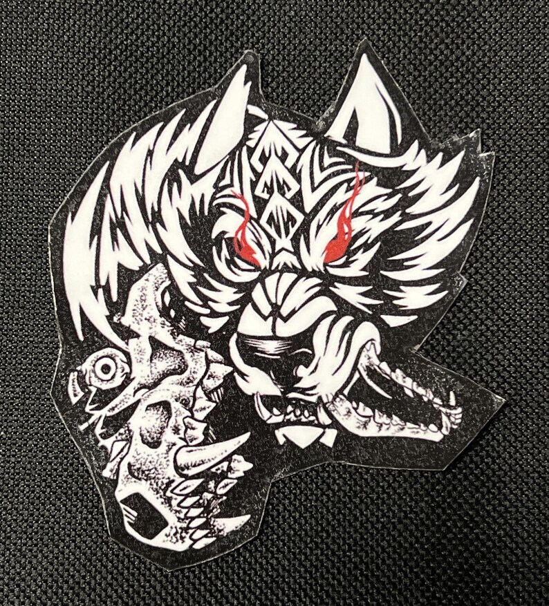 May include: Black and white illustration of a wolf with red eyes snarling and holding a skull in its mouth.