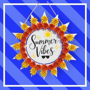 May include: A round white wooden sign with the words "Summer Vibes" in black script, surrounded by a sunburst design. The sunburst features white points, yellow and orange paper flowers, and a small sun illustration. The sign is hanging on a blue and white striped background.