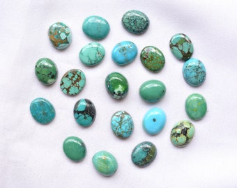 May include: A collection of 18 oval-shaped turquoise stones in various shades of blue and green. The stones have a natural, rough texture and are arranged in a circular pattern.