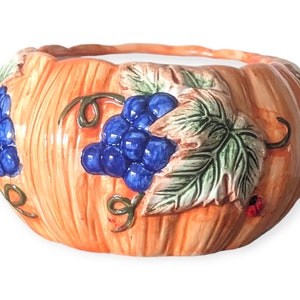 Autumn Pumpkin Majolica Candy Dish, pumpkin planter decorated with embossed blueberries, green vines, and adorable ladybugs.