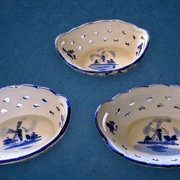 Vintage set of three Delft blue and white reticulated berry bowls, Delft of Holland, floral him and painted.