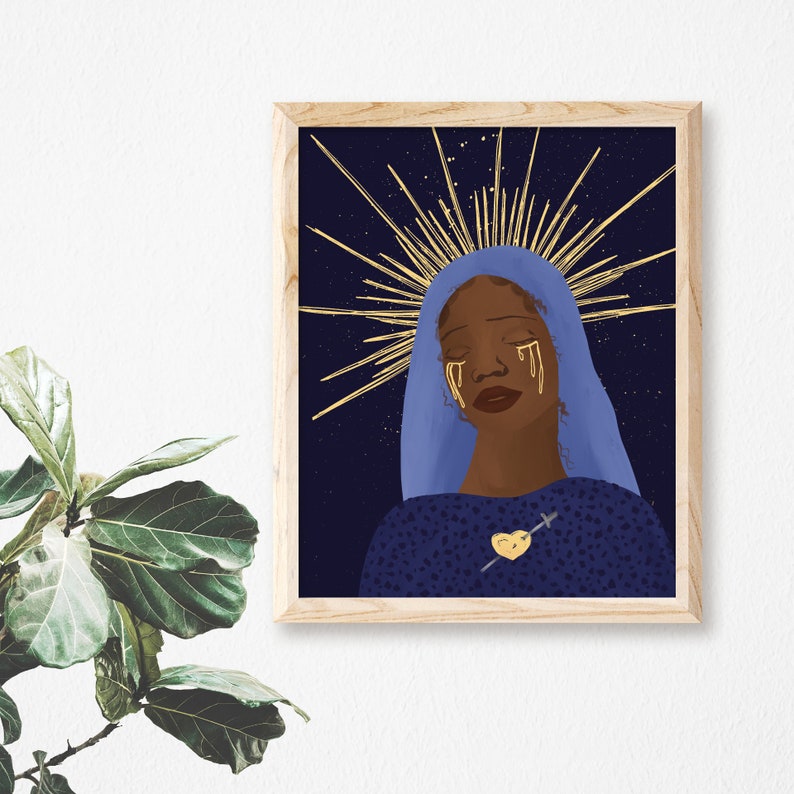 May include: A digital illustration of a woman with dark skin wearing a blue robe with a gold halo and gold tears. She has a gold heart with a gold arrow through it on her chest. The background is a dark blue with gold stars.