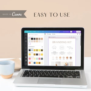 May include: A laptop screen displaying a Canva branding kit template with a pink and white color scheme. The template includes a logo, color palette, and font choices. The text "BRANDING KIT" is displayed in a black sans-serif font.
