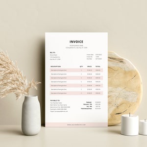 May include: A minimalist invoice template with a pink and white color scheme. The invoice includes a bill to section, description, quantity, price, and total columns. The invoice also includes a payable to section with contact information for the business.