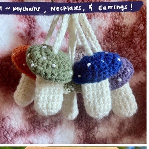 May include: Crocheted mushroom pouches, keychains, necklaces, and earrings. The mushrooms have colorful caps in blue, green, orange, and purple, with white stems. The text on the image says "CROCHET SECRET STASH MUSHROOM POUCH ~ keychains, Necklaces, & Earrings!"