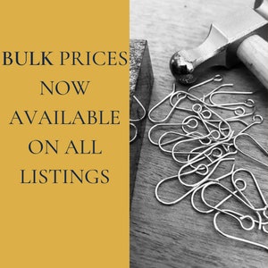 May include: Bulk prices are now available on all listings. A black and white image of a hammer and a pile of silver earring hooks.