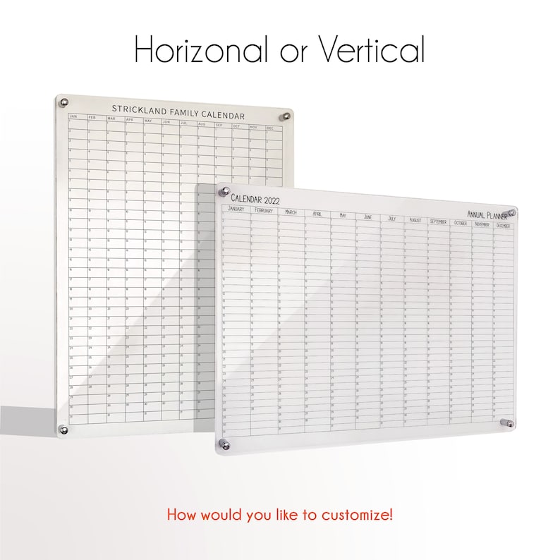 May include: Two clear acrylic dry-erase calendars, one with a monthly layout for 2022 and the other with a yearly layout. The monthly calendar has the text "CALENDAR 2022" and the yearly calendar has the text "ANNUAL PLANNER". Both calendars have the text "STRICKLAND FAMILY CALENDAR" at the top.