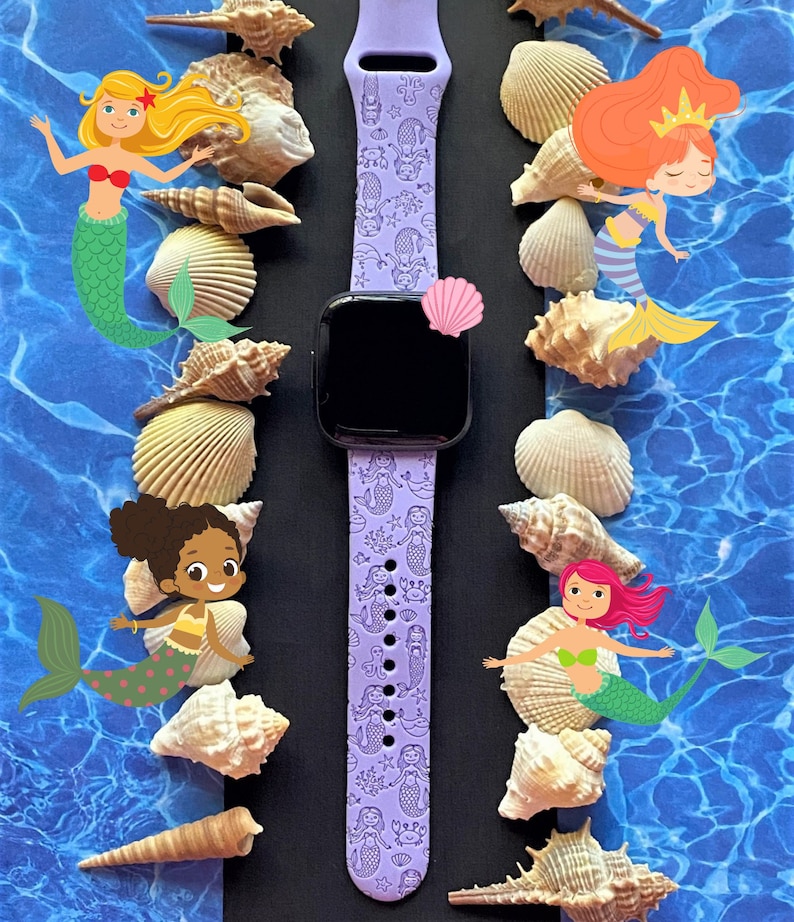 May include: A purple silicone Apple Watch band with a mermaid pattern. The band features a variety of mermaids, seashells, and starfish. The band is surrounded by seashells and a blue and white background.