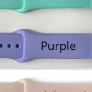 May include: Three Apple Watch bands in different colors: teal, purple, and pink sand. Each band has a row of four small holes.