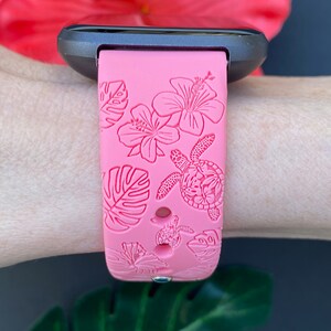 May include: Pink silicone watch band with a tropical floral and turtle design.