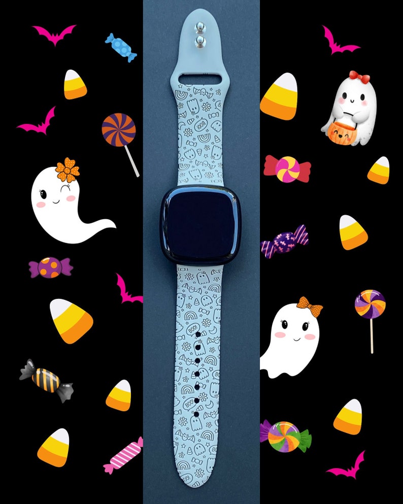 May include: A light gray silicone watch band with a black watch face. The band is decorated with a white and black pattern of ghosts, candy corn, bats, and other Halloween-themed imagery.