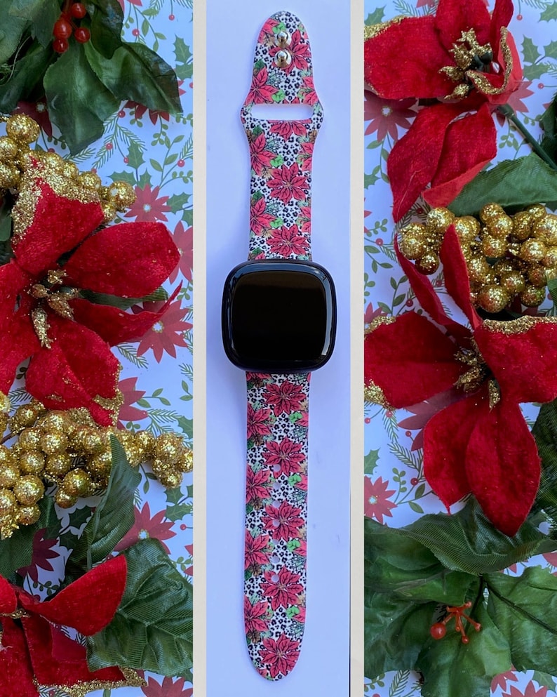 K&ouml;nnte beinhalten: Ein pinkfarbenes und wei&szlig;es Armband mit einem Poinsettien- und Leopardenmuster. Das Armband ist mit einer Smartwatch kompatibel.