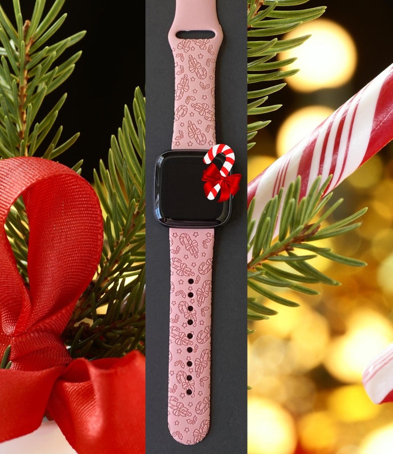 May include: Pink Apple Watch band with a candy cane and star pattern. The band is shown on a black background with a candy cane and a red bow.
