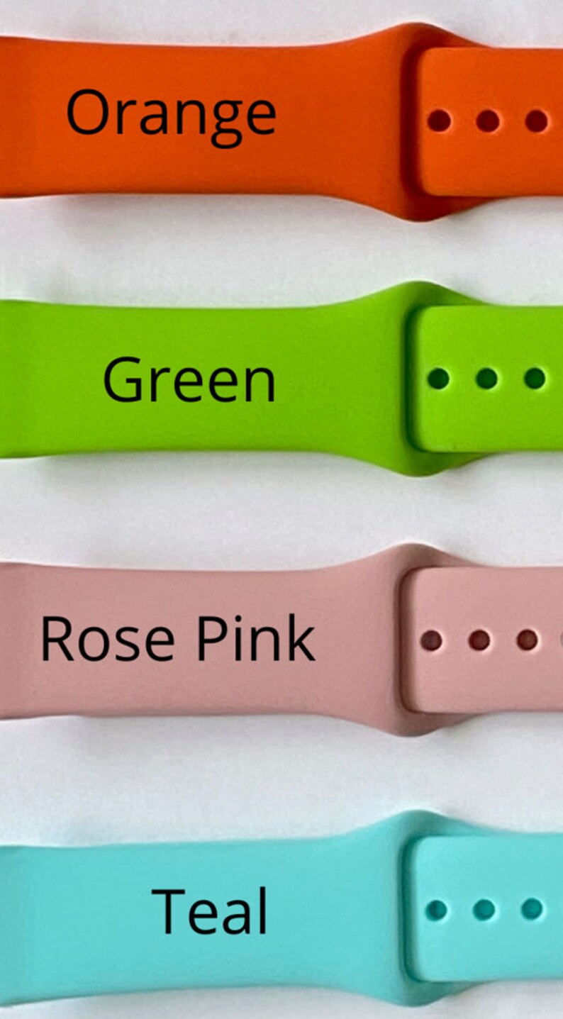 May include: Four silicone watch bands in different colours: orange, green, rose pink, and teal. Each band has three holes for adjusting the fit.