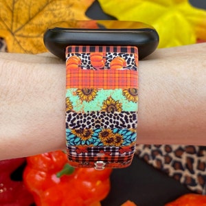 Pode incluir: Uma pulseira de rel&oacute;gio colorida com um padr&atilde;o de ab&oacute;boras, girass&oacute;is, xadrez e estampa de leopardo. A pulseira &eacute; feita de silicone e &eacute; compat&iacute;vel com Apple Watch.