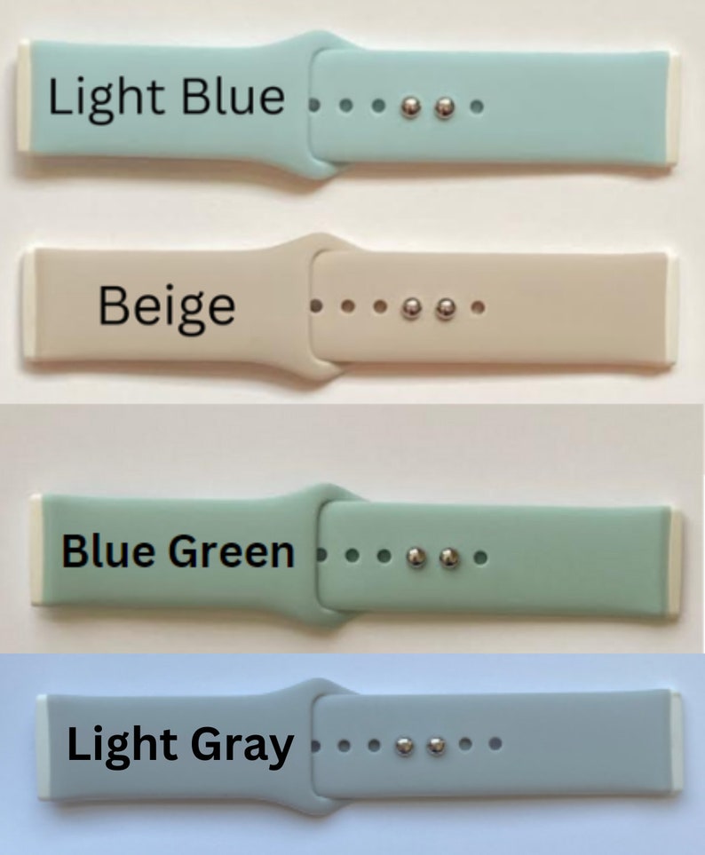 May include: Four silicone watch straps in different colours: light blue, beige, blue green, and light grey. Each strap has a white edge and silver metal accents.